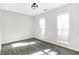 Sunlit bedroom with neutral walls and carpet floors at 1007 Broadway St, Indianapolis, IN 46202