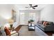Living room with gray couch, coffee table, and hardwood floors at 1007 Broadway St, Indianapolis, IN 46202