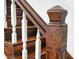 Close-up of an ornately carved wooden staircase newel post at 1007 Broadway St, Indianapolis, IN 46202