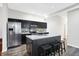 Modern kitchen with stainless steel appliances and an island with seating at 1007 Broadway St, Indianapolis, IN 46202