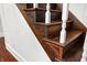 Elegant wooden staircase with carved detailing and white balusters at 1007 Broadway St, Indianapolis, IN 46202