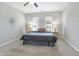 Spacious bedroom with a king-size bed and large windows at 1007 Broadway St, Indianapolis, IN 46202
