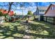 Landscaped backyard with fire pit and playset at 1007 Broadway St, Indianapolis, IN 46202