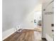 Spacious bonus room with wood flooring and access to bathroom at 1007 Broadway St, Indianapolis, IN 46202