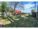 Spacious backyard with fire pit and playset at 1007 Broadway St, Indianapolis, IN 46202