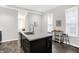 Modern kitchen with stainless steel appliances and island at 1007 Broadway St, Indianapolis, IN 46202