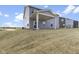 Covered patio and grassy backyard of two-story house at 230 Mcnair Rd, Whiteland, IN 46184