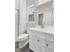 Clean bathroom featuring a white vanity, shower, and toilet at 230 Mcnair Rd, Whiteland, IN 46184