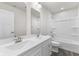 Bathroom with double vanity, tub, and grey floor at 230 Mcnair Rd, Whiteland, IN 46184