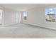 Bright bedroom featuring neutral walls, carpeting, and two large windows at 230 Mcnair Rd, Whiteland, IN 46184
