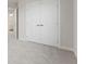 Spacious bedroom closet with double doors and neutral carpeting at 230 Mcnair Rd, Whiteland, IN 46184