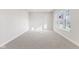 Bright bedroom with carpeted floors and large windows at 230 Mcnair Rd, Whiteland, IN 46184