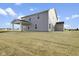 Two-story house with covered patio and grassy backyard at 230 Mcnair Rd, Whiteland, IN 46184