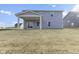 Gray house exterior with a covered patio and grassy backyard at 230 Mcnair Rd, Whiteland, IN 46184