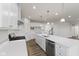 Spacious kitchen with white cabinets, island, and stainless steel appliances at 230 Mcnair Rd, Whiteland, IN 46184