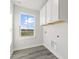 Laundry room with upper cabinets and a view at 230 Mcnair Rd, Whiteland, IN 46184