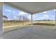 Covered patio offers views of the backyard and neighborhood at 230 Mcnair Rd, Whiteland, IN 46184