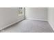 Spacious bedroom with grey carpet, large window, and neutral walls at 250 Mcnair Rd, Whiteland, IN 46184