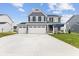 Two-story house with gray siding, white trim, and a three-car garage at 250 Mcnair Rd, Whiteland, IN 46184