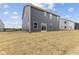Gray house exterior with sliding glass doors and a grassy yard at 250 Mcnair Rd, Whiteland, IN 46184