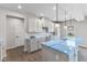 Bright kitchen boasts white cabinets, light blue quartz countertops, and pendant lighting at 250 Mcnair Rd, Whiteland, IN 46184