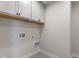 Laundry room with upper cabinets and tile floor at 250 Mcnair Rd, Whiteland, IN 46184