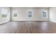 Spacious living room with hardwood floors and a view of the backyard at 250 Mcnair Rd, Whiteland, IN 46184