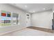 Bright living room with hardwood floors, neutral walls, and a view of the street at 250 Mcnair Rd, Whiteland, IN 46184