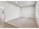 Spacious living room with light gray walls, carpeting, and hardwood floors at 250 Mcnair Rd, Whiteland, IN 46184