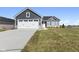 White two-car garage and gray siding highlight this newly built home's exterior at 432 Charles Freer Ln, Whiteland, IN 46184
