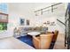 Bright living room featuring hardwood floors and a two-story ceiling at 13438 Silverstone Dr, Fishers, IN 46037