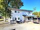 Two-story home with a covered porch and parking at 290 W Washington St, Martinsville, IN 46151