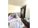 Adorable Bedroom featuring a crib, dresser, and ample closet space at 290 W Washington St, Martinsville, IN 46151