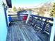 Wooden deck with chairs, bicycle, and longboard at 290 W Washington St, Martinsville, IN 46151