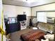 Simple bedroom with double bed, dresser, and window at 290 W Washington St, Martinsville, IN 46151