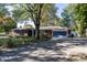 Brick ranch house with attached garage and driveway at 7060 S Meridian St, Indianapolis, IN 46217