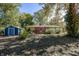 Brick house, deck and blue shed in backyard setting at 7060 S Meridian St, Indianapolis, IN 46217