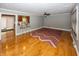 Hardwood floors, red and brown zig zag rug, and kitchen view at 7060 S Meridian St, Indianapolis, IN 46217