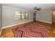 Hardwood floors, red and brown zig zag rug, and view to entry at 7060 S Meridian St, Indianapolis, IN 46217