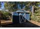 Blue shed with white X-design on the door at 7060 S Meridian St, Indianapolis, IN 46217
