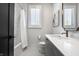 Clean bathroom with white subway tile, a built-in vanity, and a checkerboard floor at 456 Monon Way Dr, Carmel, IN 46032