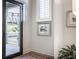 Bright entryway with modern door, window, and tasteful wall art at 456 Monon Way Dr, Carmel, IN 46032