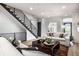 Living area showcasing a modern staircase and comfortable seating at 456 Monon Way Dr, Carmel, IN 46032
