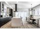 Modern kitchen with island, stainless steel appliances, and a dining area at 456 Monon Way Dr, Carmel, IN 46032