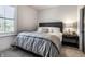 Cozy bedroom featuring a gray bedding set and a dark wood headboard at 456 Monon Way Dr, Carmel, IN 46032