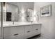 Modern bathroom with double vanity, grey tile, and bright lighting at 456 Monon Way Dr, Carmel, IN 46032