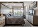 Main bedroom with a canopy bed, ample storage, and a TV at 456 Monon Way Dr, Carmel, IN 46032
