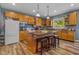 Modern kitchen with an island, wooden cabinets, and stainless steel appliances at 512 S Cherry St, Westfield, IN 46074