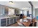 Kitchen with gray cabinets and a dining area at 1120 Lexington Ave, Indianapolis, IN 46203