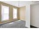 Bright bedroom featuring grey walls and ample natural light at 1120 Lexington Ave, Indianapolis, IN 46203